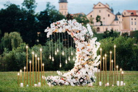 Creative moon shaped floral installation for outdoor wedding. 