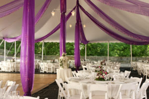 Purple drape in wedding tent
