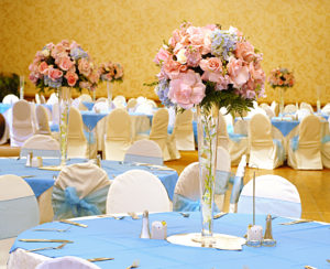 Elegant baby blue and pastel pink flowers for a gender reveal event