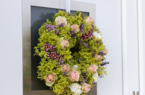 Green wreath with flowers