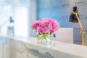 Pink peonies on marble table